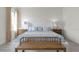 Relaxing bedroom with a plush bed, wooden bench, and matching bedside tables at 2940 Moulin Rd, Davenport, FL 33837
