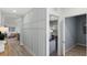 Hallway featuring a decorative wall and light wood-look floors leading to other rooms at 2964 Moulin Rd, Davenport, FL 33837