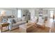 Inviting living area with open layout, stylish furnishings, and abundant natural light from large windows at 2964 Moulin Rd, Davenport, FL 33837
