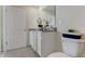 Bathroom featuring a toilet, door, and a granite countertop vanity with a large mirror at 2995 Brie Hammock Bnd, St Cloud, FL 34773