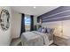 Bedroom featuring a bed with space themed bedspread and matching curtains with a window view at 2995 Brie Hammock Bnd, St Cloud, FL 34773
