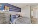 Bedroom featuring a bed with space themed bedspread and matching artwork and door to hallway at 2995 Brie Hammock Bnd, St Cloud, FL 34773