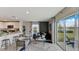 Bright living room with large sliding doors and backyard view, open to the modern kitchen at 2995 Brie Hammock Bnd, St Cloud, FL 34773
