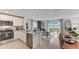 Modern living space with stainless appliances, granite countertops, and a view of the patio at 2995 Brie Hammock Bnd, St Cloud, FL 34773