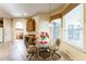 Inviting dining area with a glass table, four chairs, and natural light at 305 Grand Reserve Dr, Davenport, FL 33837