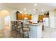 Open kitchen with bar seating and lots of cabinetry at 305 Grand Reserve Dr, Davenport, FL 33837