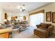 Cozy living room featuring plush seating and an open layout with lots of sunlight at 305 Grand Reserve Dr, Davenport, FL 33837