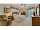 Relaxing main bedroom with a king-sized bed, ample natural light, and access to the pool area at 305 Grand Reserve Dr, Davenport, FL 33837