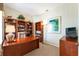 Home office boasts built-in bookshelves and a comfortable workspace at 305 Grand Reserve Dr, Davenport, FL 33837
