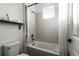 Bright bathroom with a shower and tub combination and a neutral color palette at 3172 Montserrat Pl, Kissimmee, FL 34743