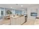 Well-lit kitchen with a center island and stainless steel appliances at 3448 Costello Cir, Winter Haven, FL 33884