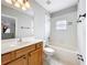 Traditional bathroom featuring a tub/shower combination and a wooden vanity at 411 Old Farm Ln, Winter Springs, FL 32708
