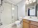 Well-lit bathroom features a glass shower, vanity with sink, and tile flooring at 411 Old Farm Ln, Winter Springs, FL 32708