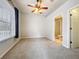 Bright bedroom with a ceiling fan, plush carpet, and ensuite bathroom with shower at 411 Old Farm Ln, Winter Springs, FL 32708