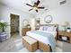 Bright bedroom featuring a cozy bed, light wood furniture, and an en-suite bathroom at 411 Old Farm Ln, Winter Springs, FL 32708