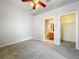 Empty bedroom features carpet, ceiling fan, with ensuite and closet doors visible at 411 Old Farm Ln, Winter Springs, FL 32708
