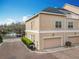 Townhouse with a brick-paved driveway, a one car garage and a small garden at 411 Old Farm Ln, Winter Springs, FL 32708