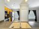 Well-lit kitchen features a stainless steel dishwasher and a breakfast bar at 411 Old Farm Ln, Winter Springs, FL 32708
