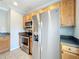 Modern kitchen featuring stainless steel appliances and warm wooden cabinetry at 411 Old Farm Ln, Winter Springs, FL 32708