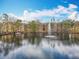 Scenic view of the pond with a fountain and the complex behind it at 411 Old Farm Ln, Winter Springs, FL 32708