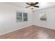 This bedroom has wood laminate flooring and two windows, perfect for natural light at 416 Davis Dr, Orlando, FL 32803