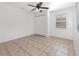 Cozy bedroom featuring neutral walls, a ceiling fan, and double door closet at 416 Davis Dr, Orlando, FL 32803