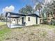 Charming single story home featuring a covered patio and well-maintained yard, perfect for outdoor enjoyment at 425 Walnut St, Daytona Beach, FL 32114