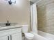 Updated bathroom with a white vanity, granite countertop, modern fixtures, and a tiled shower/tub combo at 425 Walnut St, Daytona Beach, FL 32114