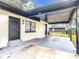 Quaint, single-story home featuring covered porch and neutral-toned brickwork, showcasing inviting curb appeal at 425 Walnut St, Daytona Beach, FL 32114