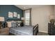 Inviting bedroom with cozy bedding, stylish decor, and plenty of natural light at 4698 Coral Harbour Rd, Kissimmee, FL 34758