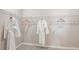 Spacious walk-in closet with custom shelving for organization and hanging space at 4698 Coral Harbour Rd, Kissimmee, FL 34758