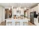Open concept kitchen with a center island with a sink, stainless steel appliances, and white cabinets at 4698 Coral Harbour Rd, Kissimmee, FL 34758