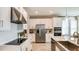Modern kitchen featuring stainless steel appliances, and an island with a sink and breakfast bar seating at 4698 Coral Harbour Rd, Kissimmee, FL 34758