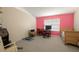 Bedroom with pink accent wall, carpet floors, window and a desk area near a daybed at 5019 Log Wagon Rd, Ocoee, FL 34761