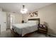 Bedroom with neutral walls, carpet floors, ceiling fan, and a bed with a nightstand at 5019 Log Wagon Rd, Ocoee, FL 34761