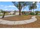 Charming single-story home with well-manicured front yard and attached garage at 5019 Log Wagon Rd, Ocoee, FL 34761
