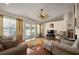 Spacious living room with hardwood floors, lots of natural light, and sliding door access at 5019 Log Wagon Rd, Ocoee, FL 34761