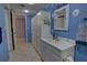 Bright full bathroom with a vanity with storage, mirror, and decorative touches for a functional and attractive space at 5201 S Atlantic Ave # 301A, New Smyrna Beach, FL 32169