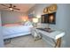 Guest bedroom also serves as office space with a desk area, adjacent to the sun room with views at 5201 S Atlantic Ave # 301A, New Smyrna Beach, FL 32169