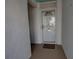 Entryway to a condo with a white door and 'Welcome' mat at 5201 S Atlantic Ave # 301A, New Smyrna Beach, FL 32169