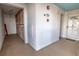 Hallway with a white entrance door and storage lockers for tenants at 5201 S Atlantic Ave # 301A, New Smyrna Beach, FL 32169