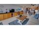 Cozy living room with comfortable seating and an open floor plan connecting to the kitchen and dining area at 5201 S Atlantic Ave # 301A, New Smyrna Beach, FL 32169