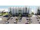 Aerial shot of the parking lot on the property with a view of the ocean and beach at 5201 S Atlantic Ave # 301A, New Smyrna Beach, FL 32169