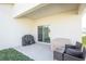 Covered patio features a grill and seating, offering an ideal space for relaxation and outdoor dining at 5342 Maddie Dr, Haines City, FL 33844