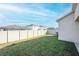 Fenced backyard with green grass providing privacy and space for outdoor activities at 5342 Maddie Dr, Haines City, FL 33844