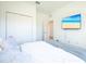 Inviting bedroom featuring a TV, double closets, and a comfortable bed with white bedding at 5342 Maddie Dr, Haines City, FL 33844