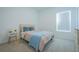 Bedroom with carpet, neutral walls, and gold bed frame, plus natural light from the window at 5342 Maddie Dr, Haines City, FL 33844