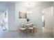 Bright dining room featuring modern furniture, tile floors, and natural lighting at 5342 Maddie Dr, Haines City, FL 33844