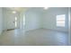 Open concept living room featuring new tile floors, bright walls, and plenty of space at 5342 Maddie Dr, Haines City, FL 33844
