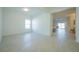 Spacious open-concept living room with tile floors, recessed lighting, and access to a dining area at 5342 Maddie Dr, Haines City, FL 33844